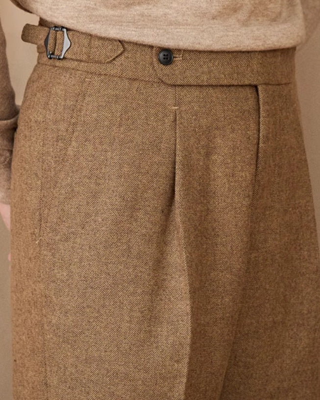 Discover the Whitby Wool Trousers crafted in a premium wool blend with a refined tailored fit, adjustable side buckles, and timeless British-inspired elegance.